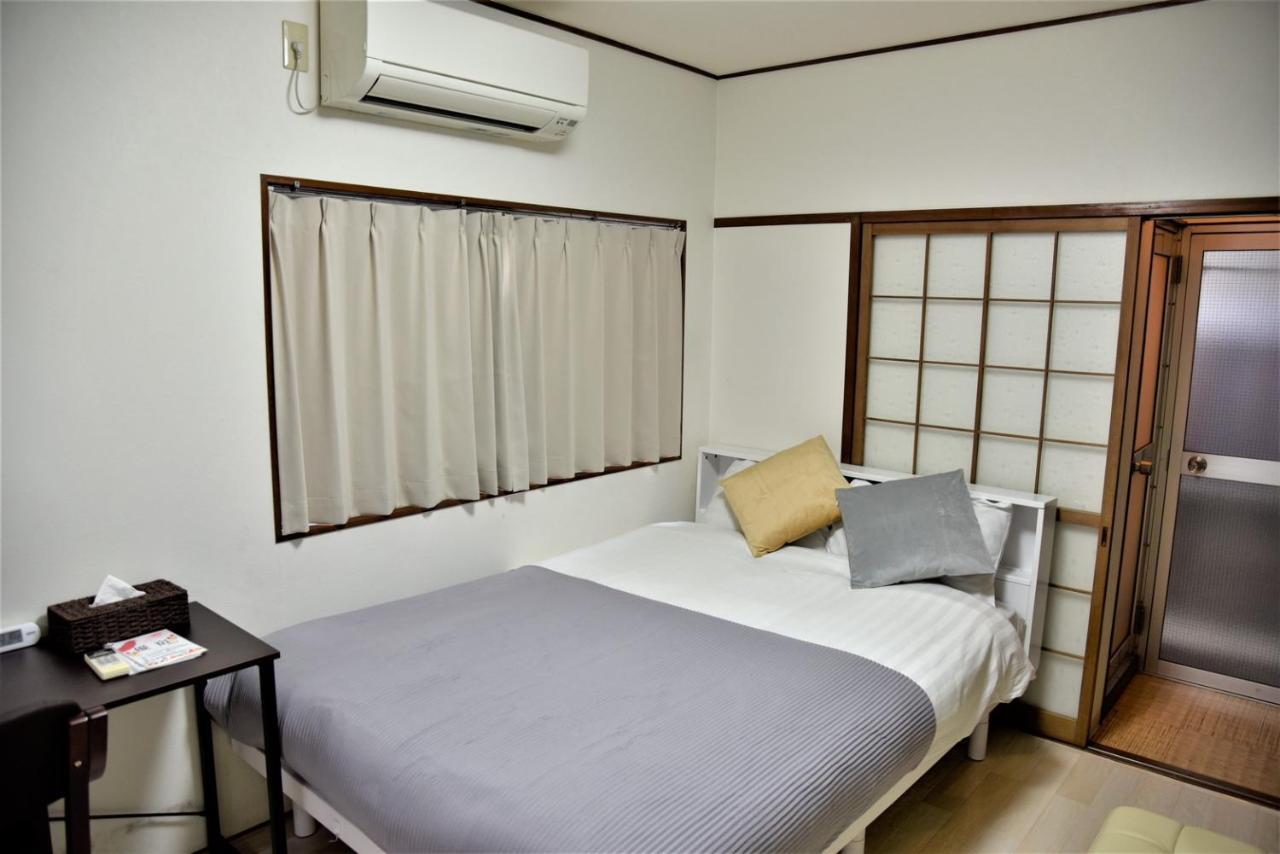 Osaka U-Shuku Apartment Bagian luar foto